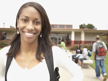 Young African woman smiling on school campus
