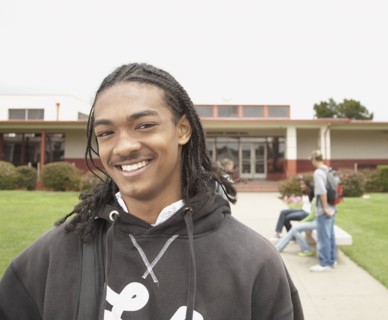 Young African man smiling on school campus
