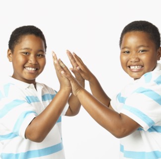 Young African twin brothers smiling