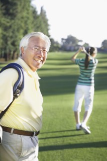 Senior Asian man on golf course