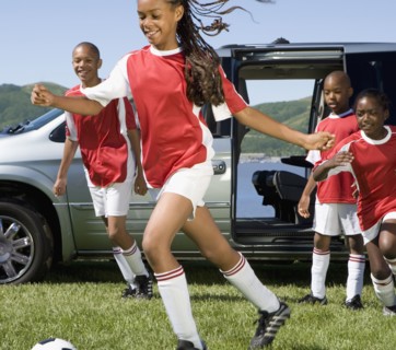 Multi-ethnic children in soccer uniforms