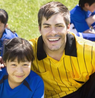 Portrait of Asian girl and soccer coach