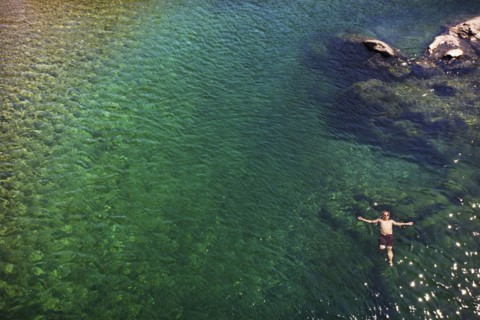 Caucasian man swimming in ocean