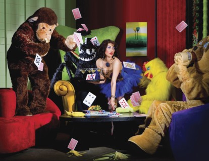 People in animal costumes playing poker