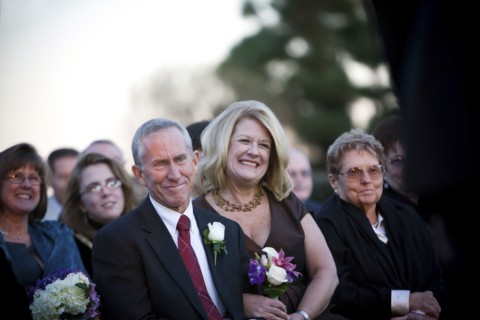 Family and guests watching wedding