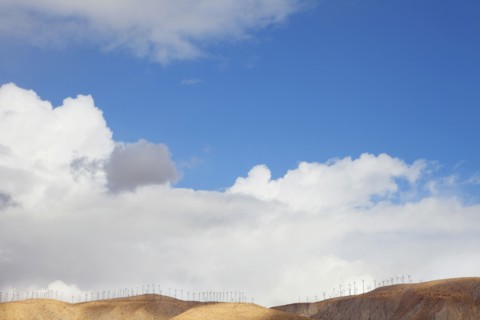 Blue sky and wind farm on hilltop