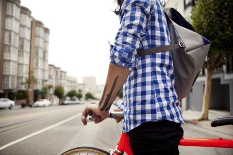 Vietnamese bicycle messenger on city street