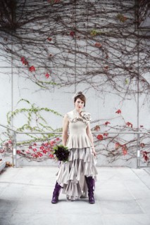 Glamorous bride standing with bouquet