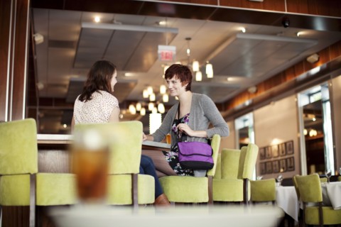 Caucasian women having lunch in diner