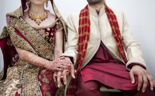 Bride and groom in traditional Indian wedding clothing