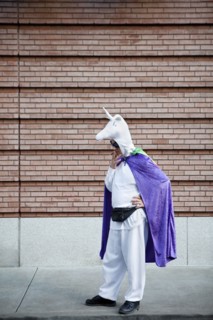 Caucasian man in unicorn costume