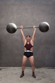 Caucasian weight lifter straining
