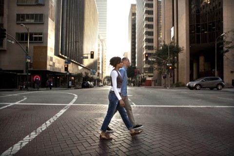 Couple crossing city street