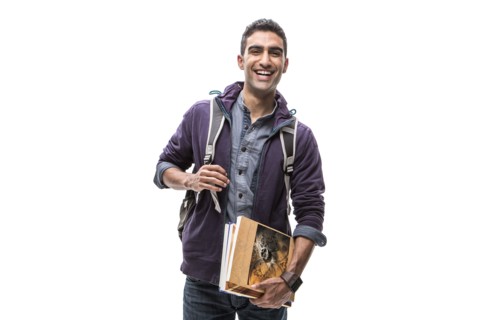 Indian student carrying books and backpack