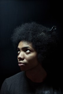 African American man wearing comb in afro hairstyle