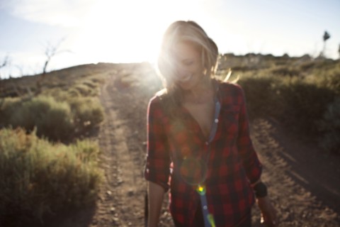 Caucasian woman walking on dirt road