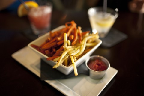 Close up of bowl of french fries in restaurant