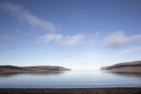 Hills and remote ocean horizon