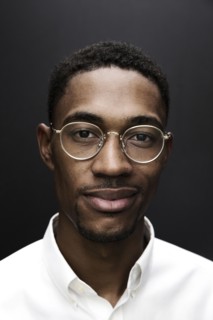 Portrait of smiling Black man wearing eyeglasses
