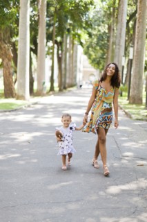 Mother and daughter walking in park