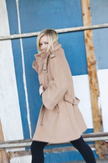 Caucasian woman wearing trenchcoat