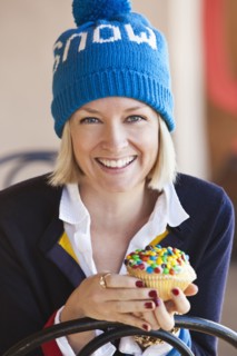 Caucasian woman eating cupcake