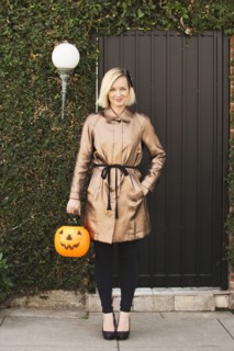 Caucasian woman carrying jack o' lantern bucket