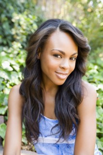 Close up of smiling woman sitting outdoors