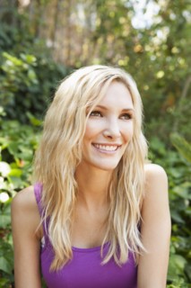 Close up of smiling woman sitting outdoors