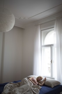Caucasian woman sleeping in bed