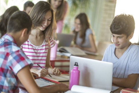 Students studying in school cafeteria