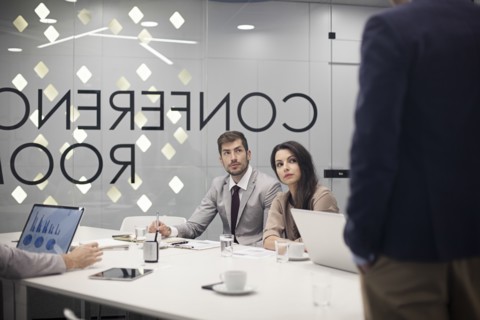 Caucasian business people listening in office meeting