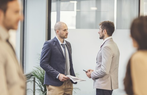 Caucasian businessmen talking in office