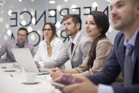 Caucasian business people listening in office meeting