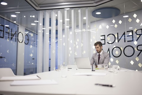 Caucasian businessman working in conference room