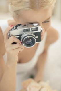 Bride photographing with vintage camera