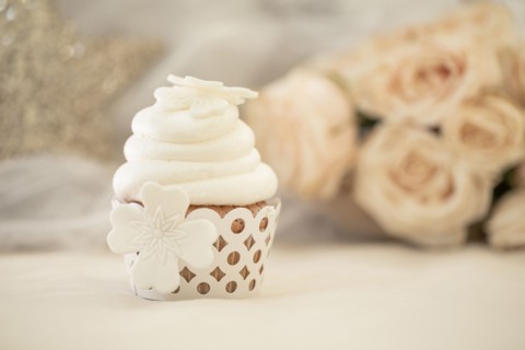 Close up of decorated cupcake with white icing