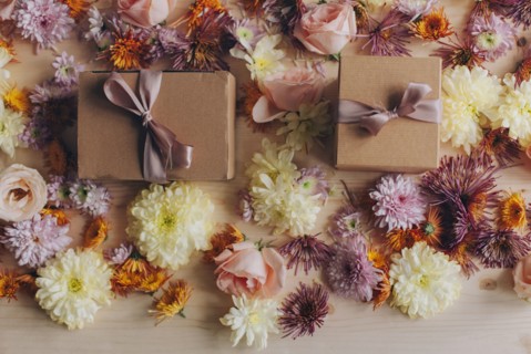 Close up of wrapped gifts and flowers