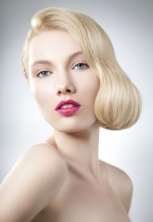 Caucasian woman with glamorous hairstyle and makeup