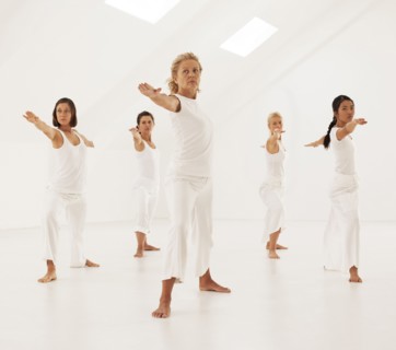 Women practicing yoga in class
