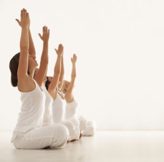 Women practicing yoga in class