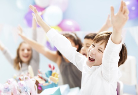 Children cheering at birthday party