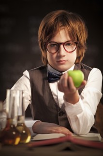 Student holding apple and studying