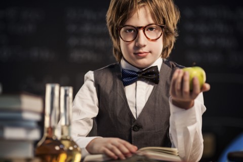 Student holding apple and studying