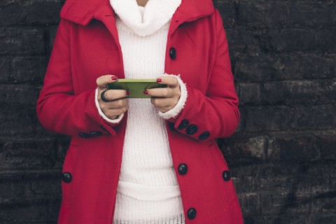 Caucasian woman using cell phone outdoors
