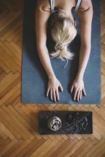 Caucasian woman practicing yoga in studio