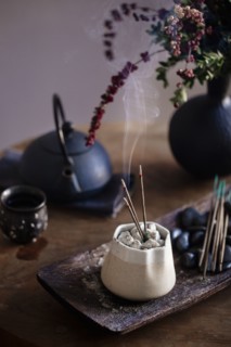 Incense burning on table