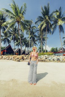 Caucasian woman walking on beach
