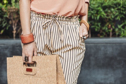 Caucasian woman carrying purse outdoors