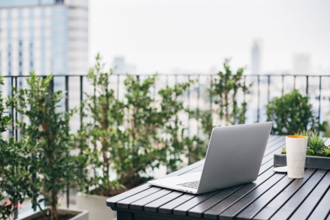 Laptop on balcony table